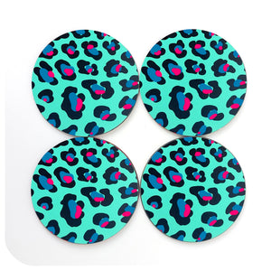 A set of 4 round leopard print coasters in bright mint green, with teal and hot pink spots on a white background | The Inkabilly Emporium