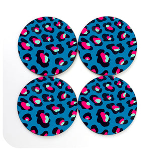 A set of 4 round leopard print coasters in teal, with turquoise and hot pink spots on a white background | The Inkabilly Emporium